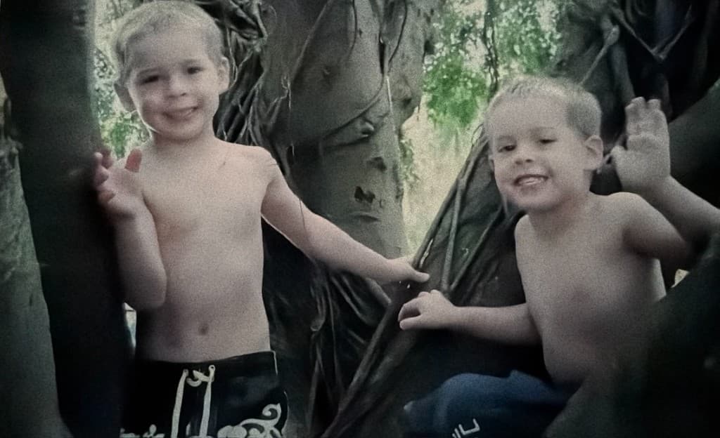 Coleman and Grayson as kids climbing trees